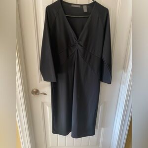 Long sleeve little black dress with front details.